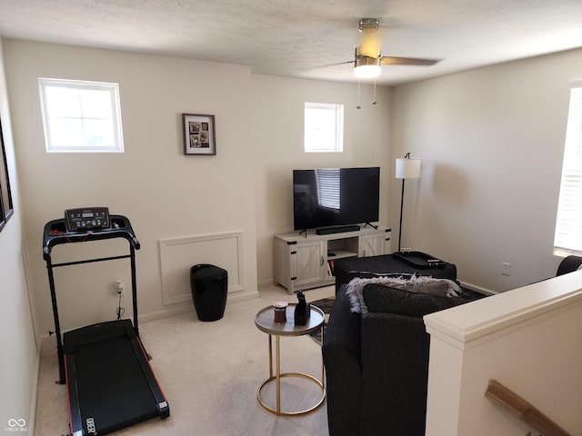 6731 Keepsake Dr, Whitestown, IN 46075 - carpeted living area with ceiling fan and baseboards
