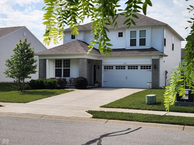 6731 Keepsake Dr, Whitestown, IN 46075 - view of front of house featuring driveway, a front yard, an attached garage, and roof with shingles