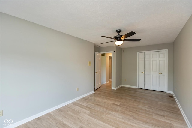 8955 Stonegate Rd Unit A, Indianapolis, IN 46227 - unfurnished bedroom featuring light wood-type flooring, a closet, and a ceiling fan