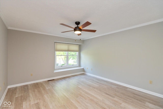 8955 Stonegate Rd Unit A, Indianapolis, IN 46227 - spare room featuring light wood-style flooring, ceiling fan, and ornamental molding