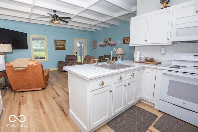 2640 E County Road 600 S, North Vernon, IN 47265 - kitchen featuring white appliances, a sink, open floor plan, a peninsula, and beam ceiling