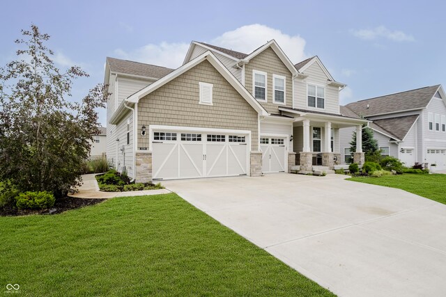 15598 Memorial Way, Fishers, IN 46037 - craftsman inspired home featuring a porch, concrete driveway, a front yard, and stone siding