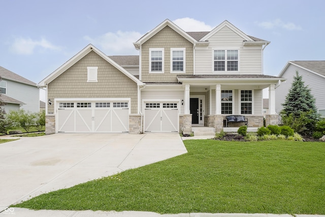 15598 Memorial Way, Fishers, IN 46037 - craftsman-style house featuring a porch, driveway, a front lawn, and stone siding