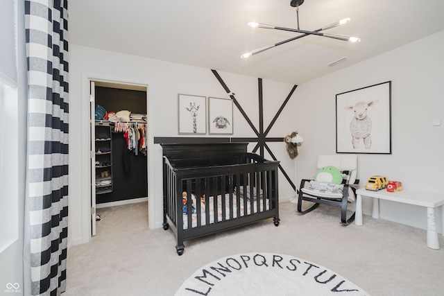 15598 Memorial Way, Fishers, IN 46037 - bedroom with carpet flooring, a spacious closet, a closet, and a chandelier