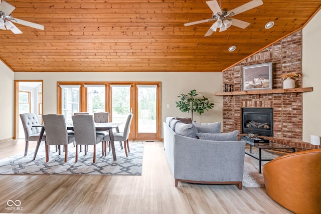 5695 N Red Oak Dr, Greenfield, IN 46140 - living room with ceiling fan, wood ceiling, high vaulted ceiling, wood finished floors, and a brick fireplace