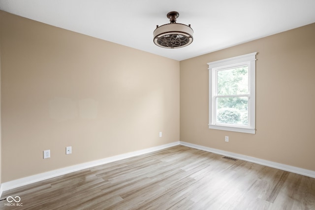 5695 N Red Oak Dr, Greenfield, IN 46140 - spare room featuring light wood-style floors and baseboards