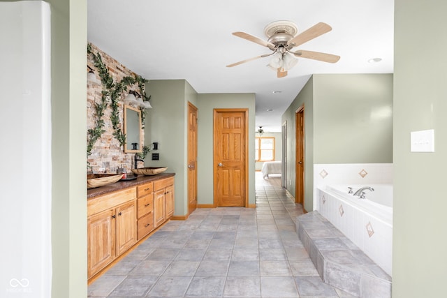 5695 N Red Oak Dr, Greenfield, IN 46140 - ensuite bathroom with a ceiling fan, a bath, and double vanity