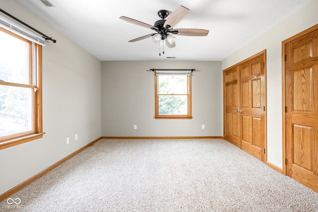 5695 N Red Oak Dr, Greenfield, IN 46140 - unfurnished bedroom with carpet, a ceiling fan, and a closet