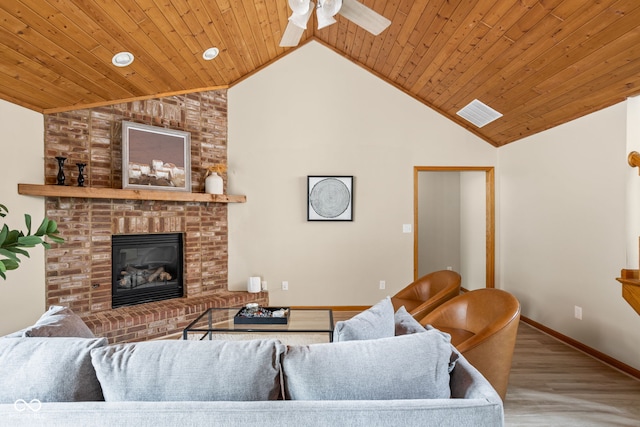 5695 N Red Oak Dr, Greenfield, IN 46140 - living area with a ceiling fan, a fireplace, wood finished floors, wood ceiling, and high vaulted ceiling