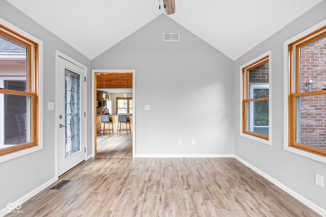 5695 N Red Oak Dr, Greenfield, IN 46140 - spare room featuring vaulted ceiling, wood finished floors, and a ceiling fan