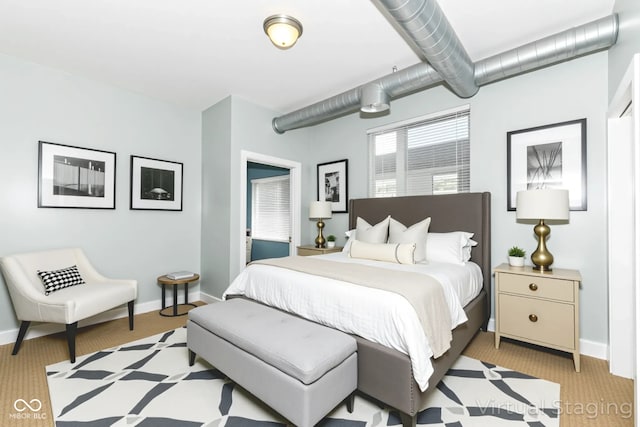 721 E N St Unit 2C, Indianapolis, IN 46202 - bedroom with light carpet and baseboards