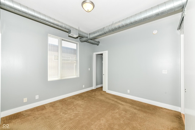 721 E N St Unit 2C, Indianapolis, IN 46202 - carpeted empty room featuring baseboards