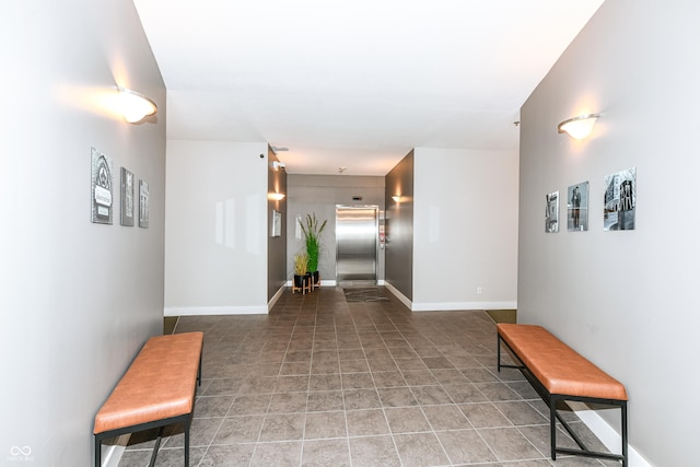 721 E N St Unit 2C, Indianapolis, IN 46202 - hallway with elevator and light tile patterned floors