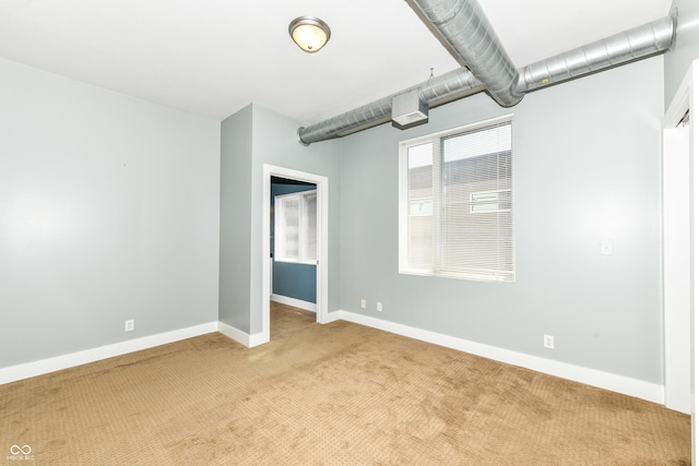 721 E N St Unit 2C, Indianapolis, IN 46202 - carpeted spare room with baseboards