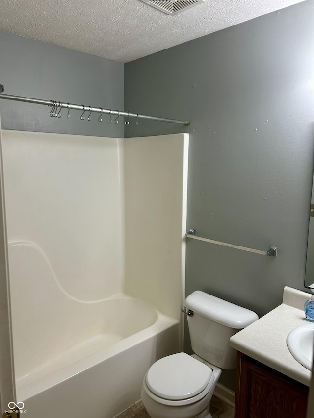 12307 Chiseled Stone Dr, Fishers, IN 46037 - bathroom with toilet, vanity, washtub / shower combination, and a textured ceiling