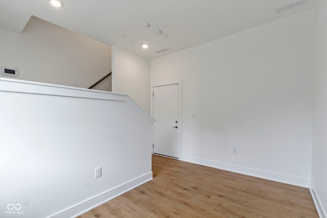 751 Switchyard Pl, Indianapolis, IN 46202 - spare room featuring baseboards, light wood finished floors, and recessed lighting