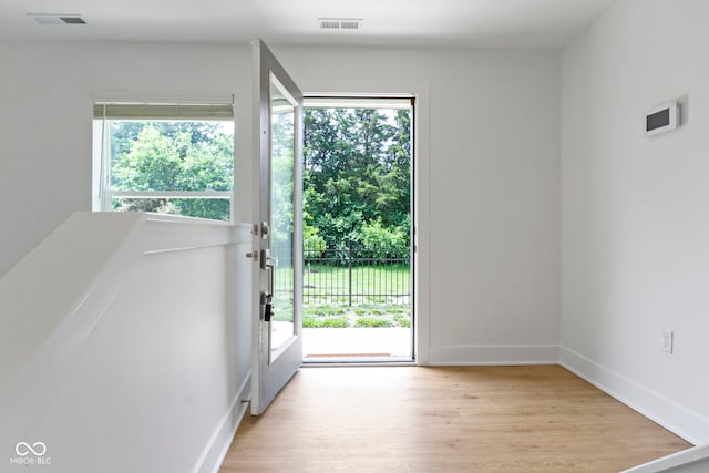 751 Switchyard Pl, Indianapolis, IN 46202 - doorway with light wood-type flooring and baseboards