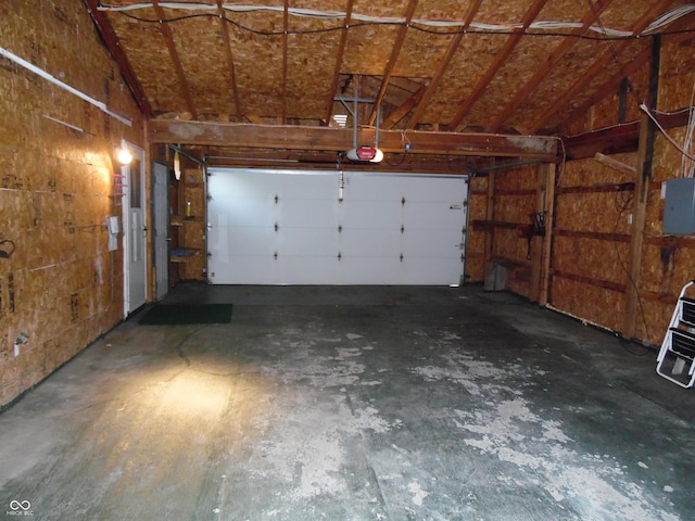 509 Eberhart Dr, Shelbyville, IN 46176 - garage featuring a garage door opener and electric panel