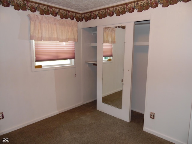 509 Eberhart Dr, Shelbyville, IN 46176 - unfurnished bedroom with carpet floors, a closet, and a textured ceiling