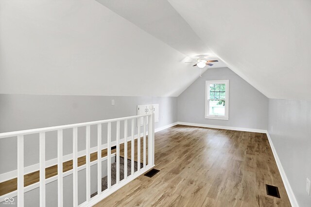 6644 Mcfarland Rd, Indianapolis, IN 46227 - additional living space featuring wood finished floors, ceiling fan, and vaulted ceiling