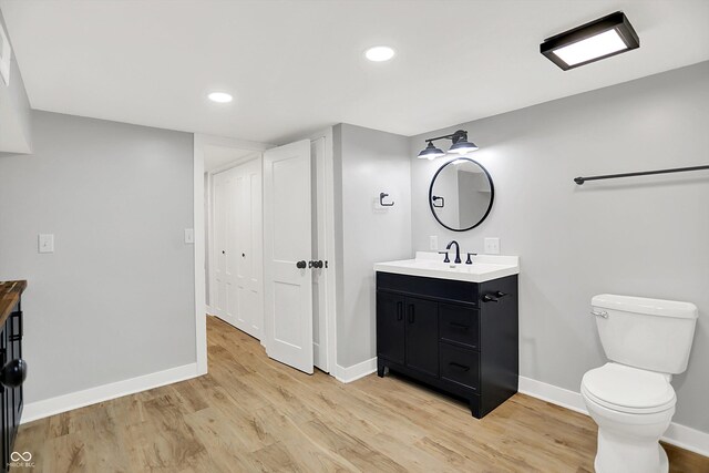 6644 Mcfarland Rd, Indianapolis, IN 46227 - bathroom with vanity, wood finished floors, and recessed lighting