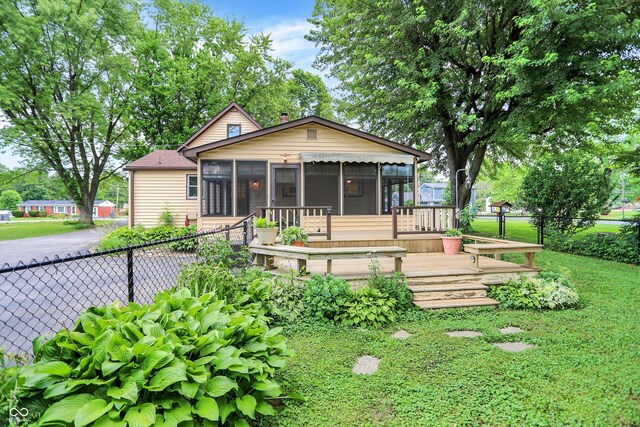 6644 Mcfarland Rd, Indianapolis, IN 46227 - view of front facade featuring a sunroom and a wooden deck