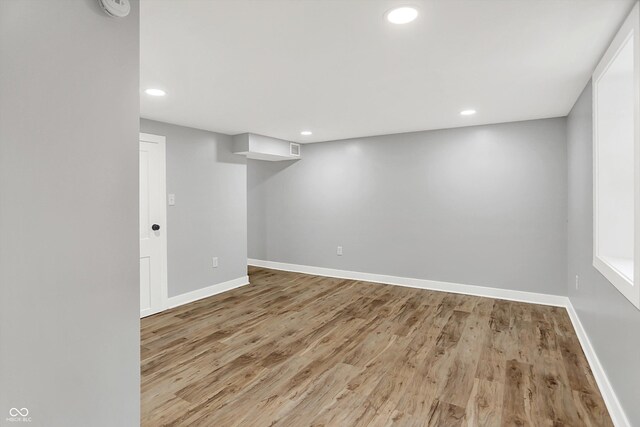6644 Mcfarland Rd, Indianapolis, IN 46227 - finished basement with light wood finished floors and recessed lighting