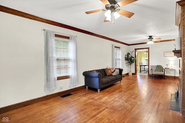 6644 Mcfarland Rd, Indianapolis, IN 46227 - living area featuring a ceiling fan, light wood-style flooring, and crown molding
