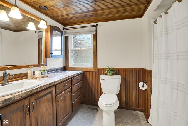 6644 Mcfarland Rd, Indianapolis, IN 46227 - full bath featuring vanity, wainscoting, wooden ceiling, wood walls, and tile patterned flooring