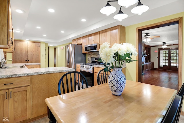 6644 Mcfarland Rd, Indianapolis, IN 46227 - dining space featuring a raised ceiling, recessed lighting, french doors, ceiling fan, and wood finished floors