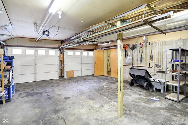 6644 Mcfarland Rd, Indianapolis, IN 46227 - garage featuring a garage door opener
