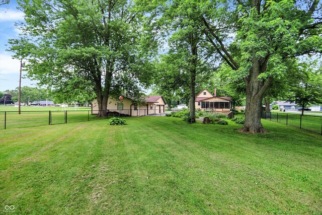 6644 Mcfarland Rd, Indianapolis, IN 46227 - view of yard with an attached garage