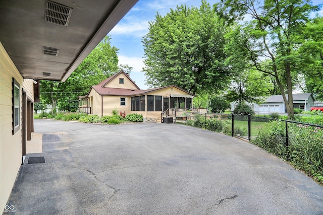6644 Mcfarland Rd, Indianapolis, IN 46227 - view of patio / terrace featuring a sunroom and driveway