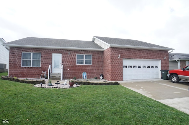 1673 W Integrity St, Greensburg, IN 47240 - ranch-style house featuring entry steps, concrete driveway, brick siding, an attached garage, and a front yard