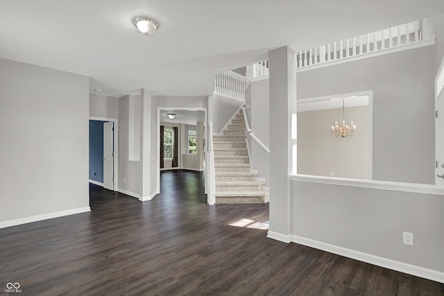 1343 Turfway Dr, Avon, IN 46123 - spare room with dark wood-type flooring, a chandelier, and stairway