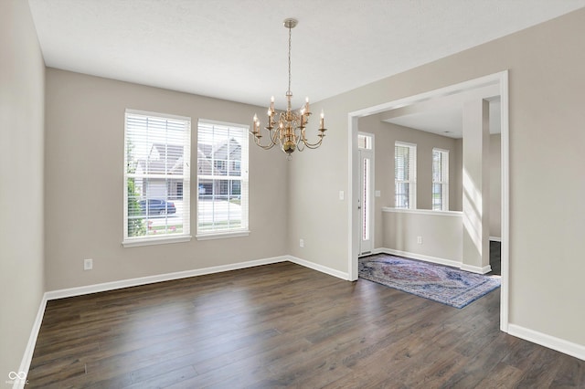 1343 Turfway Dr, Avon, IN 46123 - unfurnished room with a chandelier, plenty of natural light, and dark wood-style floors
