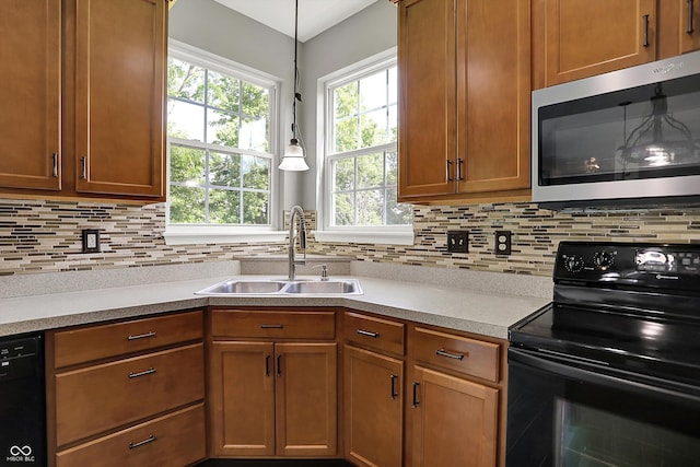 1343 Turfway Dr, Avon, IN 46123 - kitchen featuring black appliances, backsplash, light countertops, and brown cabinetry