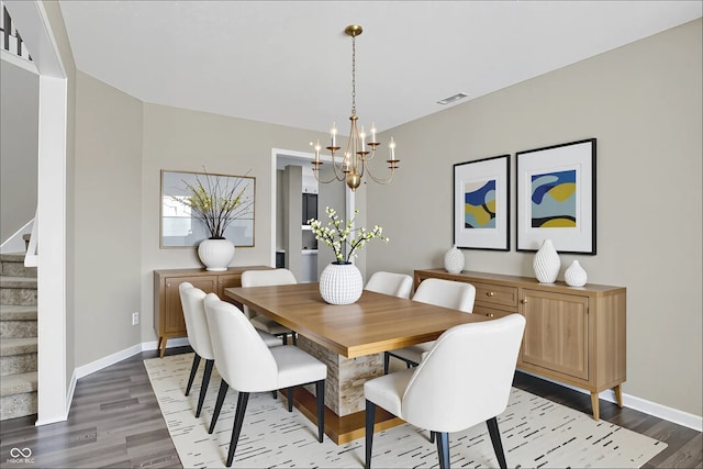 1343 Turfway Dr, Avon, IN 46123 - dining area with dark wood-type flooring, a chandelier, and stairway