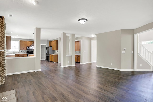 1343 Turfway Dr, Avon, IN 46123 - unfurnished living room with dark wood-style flooring and stairway