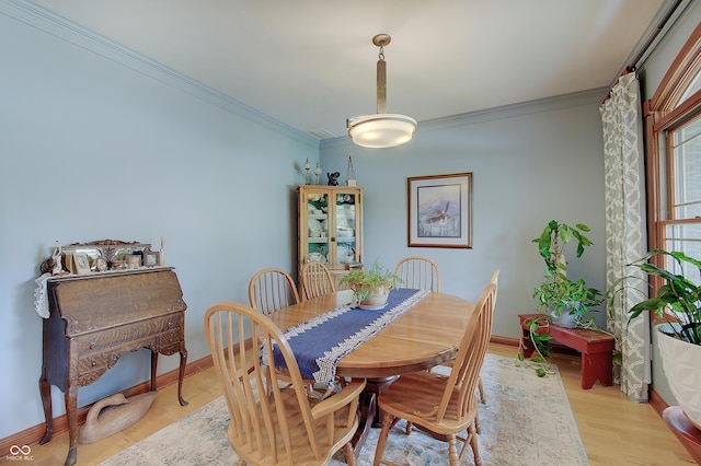 214 W Stoney Trl, Greenfield, IN 46140 - dining area with light wood-style floors and ornamental molding