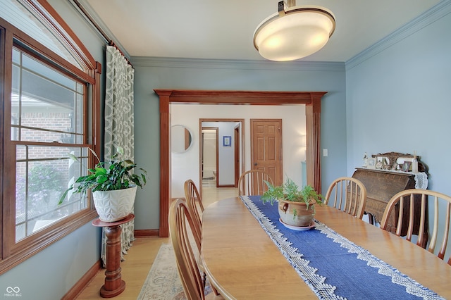 214 W Stoney Trl, Greenfield, IN 46140 - dining room featuring healthy amount of natural light, ornamental molding, and light wood-style floors