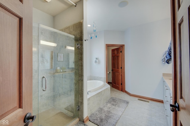214 W Stoney Trl, Greenfield, IN 46140 - full bathroom with a garden tub, vanity, a stall shower, and tile patterned floors