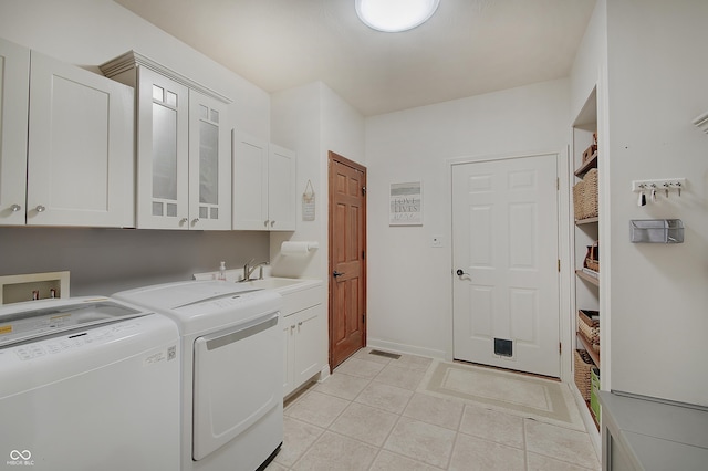 214 W Stoney Trl, Greenfield, IN 46140 - washroom featuring cabinet space, washer and clothes dryer, and light tile patterned floors