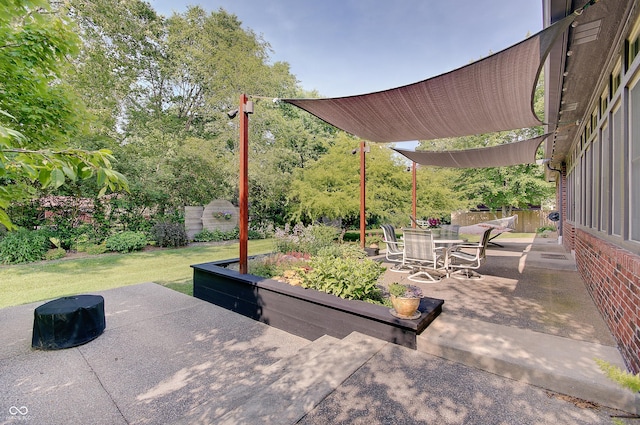 214 W Stoney Trl, Greenfield, IN 46140 - view of patio / terrace featuring outdoor dining space and view of wooded area