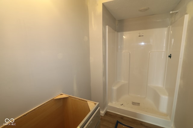 4151 Barrel Ln, Westfield, IN 46062 - bathroom featuring a shower, wood finished floors, and baseboards