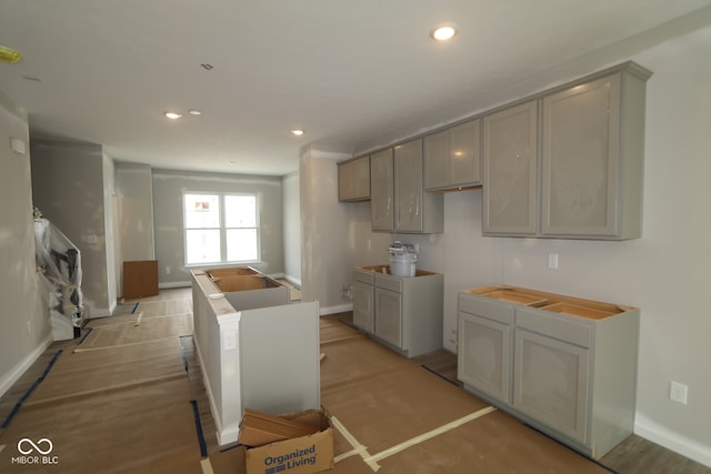 4151 Barrel Ln, Westfield, IN 46062 - kitchen with baseboards, recessed lighting, gray cabinetry, and a center island