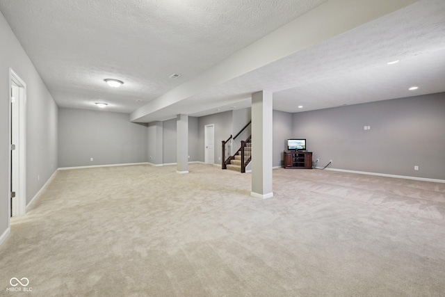 10806 Solis Cir, Fishers, IN 46038 - finished basement featuring light colored carpet, stairs, and a textured ceiling