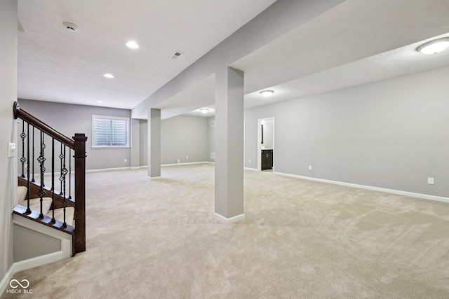 10806 Solis Cir, Fishers, IN 46038 - below grade area featuring light carpet, stairs, and recessed lighting
