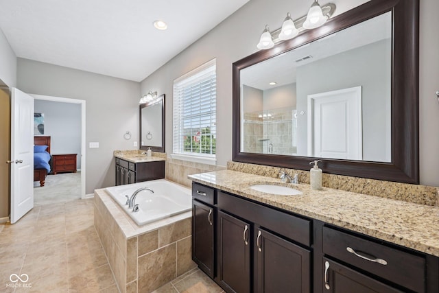 10806 Solis Cir, Fishers, IN 46038 - full bath featuring tiled shower, two vanities, a bath, and tile patterned flooring