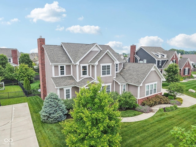 10806 Solis Cir, Fishers, IN 46038 - view of front of home featuring a chimney, a shingled roof, and brick siding